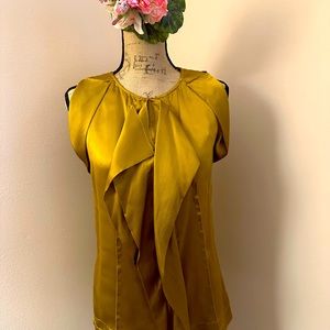 Mustard/gold colored sleeveless silk top.